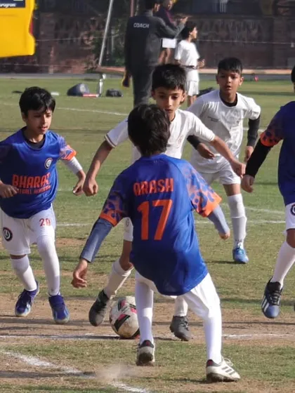 Our Under 9 team giving their all. This photo captures the energy and determination of our players during a competitive game.