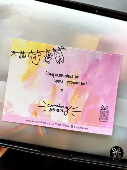 A handwritten-style 'Congratulations on your promotion!' card adds a personal and warm touch to any pregnancy reveal gift.