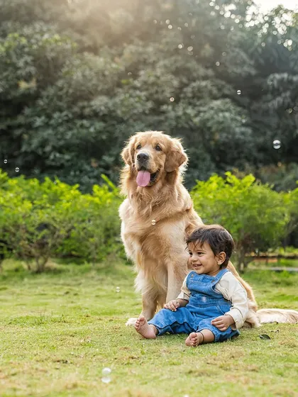 A perfect portrait of two best friends. Baby Aariv sits happily in a park next to his majestic Golden Retriever, Ollie, with bubbles floating around them. This shot captures the magic of growing up with a dog.