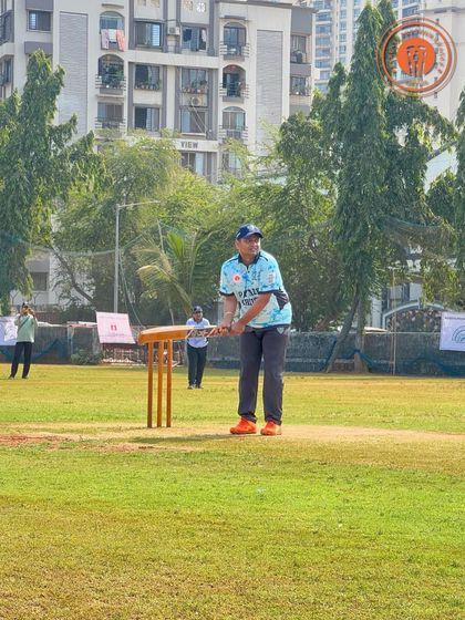 A batsman waits for the ball, bat raised, during a Parents Premier League match.