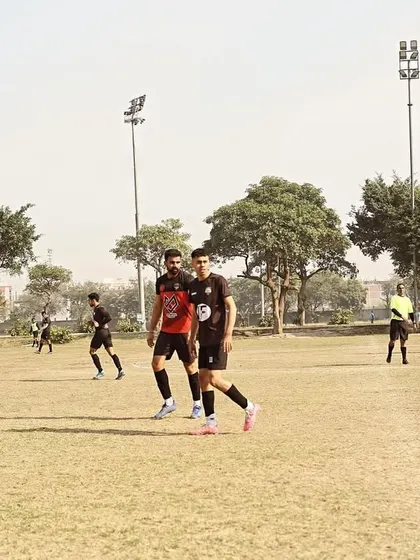 An action shot from our Gameday 1 fixture in the Super League, with players walking the pitch during a break.