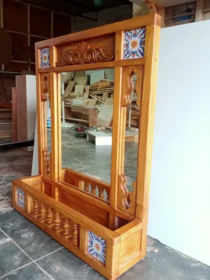 From our workshop to your home, every piece carries the mark of true craftsmanship. This jharokha-inspired mirror, seen here getting its final touches, is built with hand-carved details and inlaid tiles, showcasing the skill and passion of our artisans.
