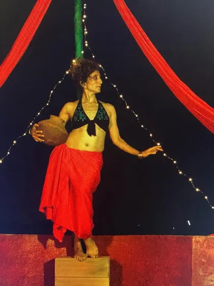 A photo of me in costume, holding a pot. This was another image shared to celebrate World Theatre Day, reflecting the diverse characters I've had the honor to portray.