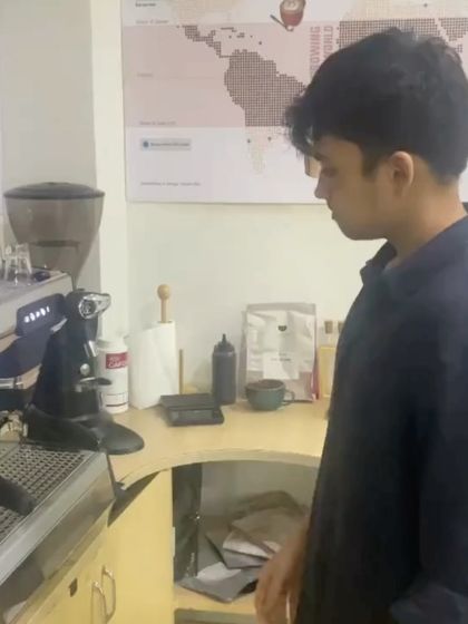A student practices on the espresso machine, a core component of our Go Abroad training. We believe in learning by doing.