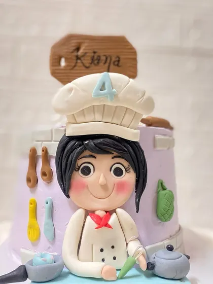 A master chef in the making. This cake, with a pistachio buttercream and strawberry filling, was designed for a 4-year-old who loves to cook.