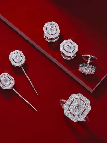 A gift that transcends trends. This stunning set of diamond-studded accessories, including cufflinks, pins, buttons, and a ring, brings sophistication to any wardrobe. Because style has no limits.