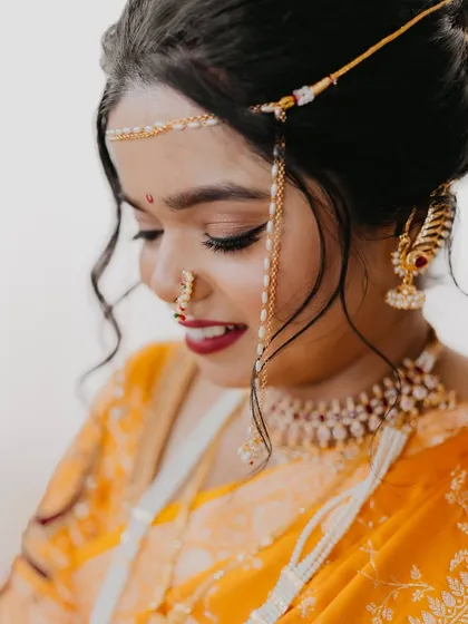 A close-up of the bride's makeup, showing the soft eyeshadow and perfectly defined features.