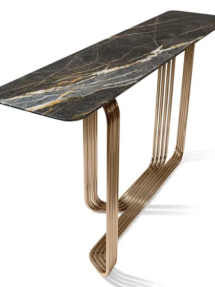 A console with a structure of chromed metal tubes, curved and welded together to create a continuous, flowing base. The top is a slab of exquisite marble with a beveled edge.
