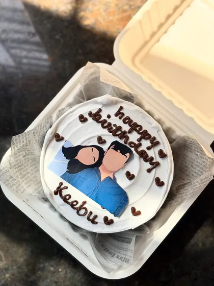 A different angle of the bento cake with the edible photo print, showing how it looks inside the gift box.