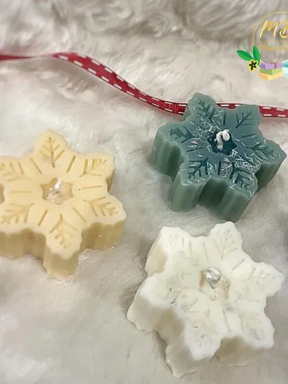 Here is a trio of my snowflake candles, showing the different colors available. Each one is delicately crafted to capture the beauty of a winter snowflake.
