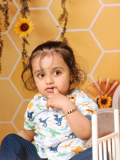A collection of candid and playful moments from a sunflower-themed session, showing a range of expressions from curious to joyful.