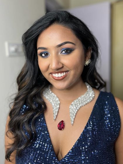 Nimisha's happy smile, ready for her Sangeeth. The bold eye is balanced with a glossy nude lip.