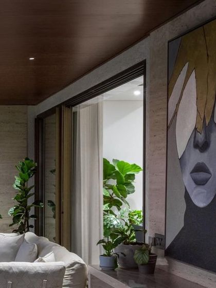 Another view of the large portrait, showing how it commands the space and works beautifully with the modern, luxurious decor of the home.