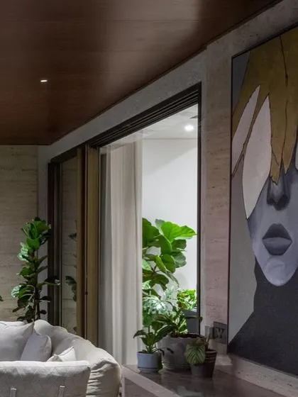 Another view of the large portrait installation, showing how it commands the space and serves as a stunning focal point for this indoor-outdoor living area.