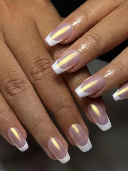A modern update to a timeless classic. This is our glazed chrome French manicure, giving you that clean, sophisticated look with an iridescent, eye-catching finish.