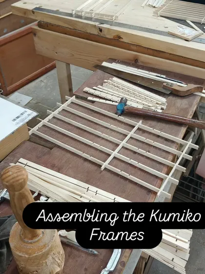 The assembly stage of the Kumiko frames. You can see the small, precisely cut wooden strips being interlocked to form the grid. We use a small hammer to gently tap everything into place.