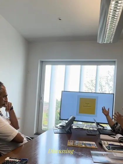 A candid moment of discussion in the studio. Every project is born from a dialogue, where we challenge and refine ideas to arrive at the best possible design.