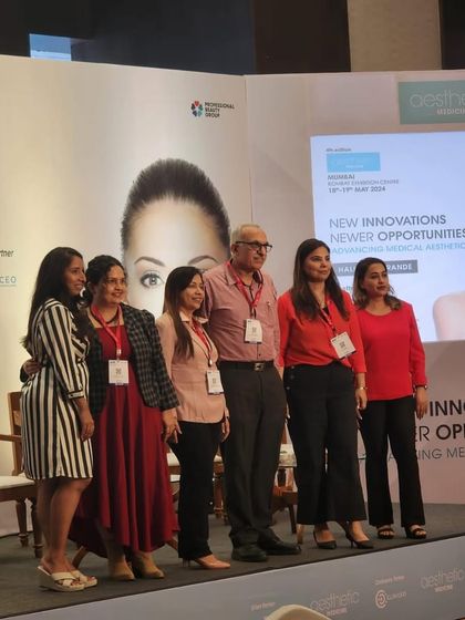 A group photo with fellow panelists at the Aesthetic Medicine conference. Collaborating with other experts is essential for bringing the best and newest innovations to my patients.