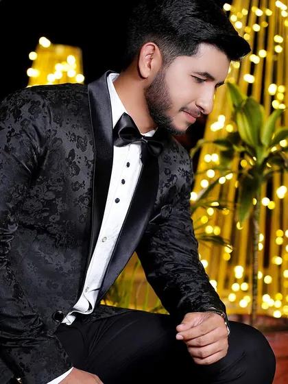 A thoughtful, low-angle shot of the groom against a beautifully lit background. This creates a dramatic and interesting portrait.