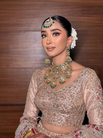 A close up of this elegant look. The makeup is soft and natural, with a focus on enhancing her features.