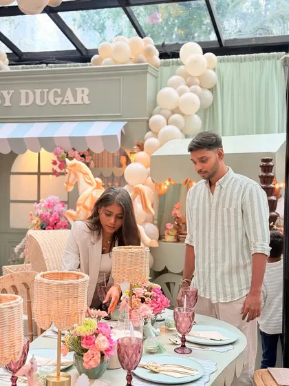 A candid moment of final checks before guests arrive, showcasing our commitment to flawless execution at this elegant baby shower.