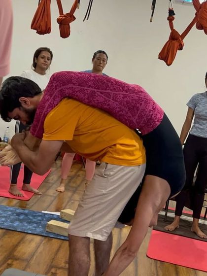 Partner work is an important part of our teacher training. Here, one student supports another in a deep, restorative backbend.
