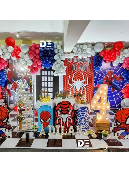 Time to be a hero! I bring the action with this dynamic Spiderman-themed party, complete with a city skyline backdrop, character cutouts, and a classic red, white, and blue balloon arch. It's a setup guaranteed to make your little one's spidey senses tingle.