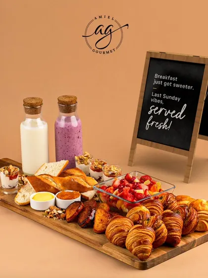 I believe breakfast should be an event. My French breakfast platter is a feast for the senses, featuring an assortment of mini viennoiseries, fresh fruit salad, granola parfaits, artisan bread with butter and jam, and fresh smoothies.