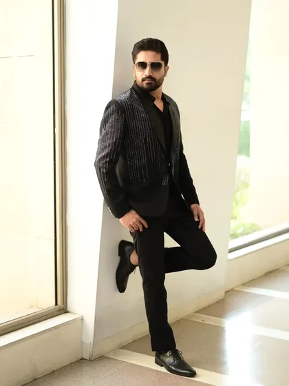 The same black sequin blazer, styled for a sharp and modern look. This piece is versatile and always makes a statement.