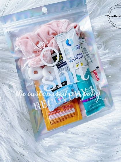 Curing wedding season hangovers, one kit at a time. This "Oh Shit Recovery Kit" is a fun and practical favor, packed in a holographic pouch for extra flair.