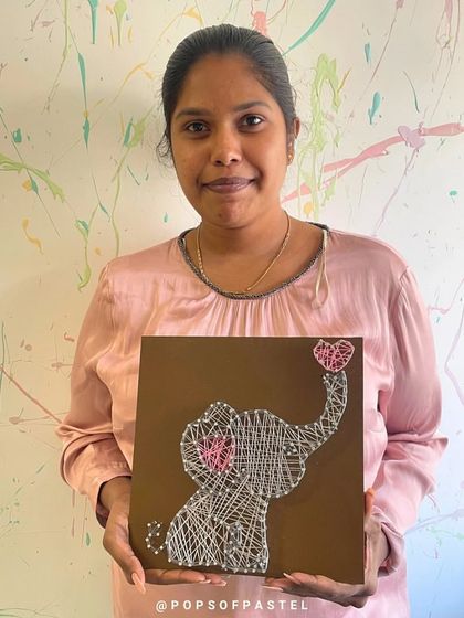 An adorable elephant string art piece, complete with a tiny heart. This design is a favorite among our workshop participants.