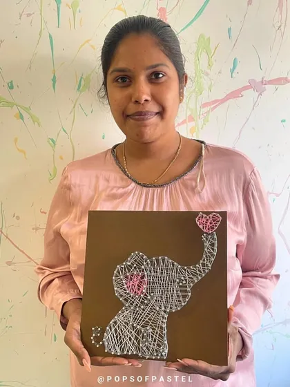An adorable elephant string art piece, complete with a tiny heart. This design is a favorite among our workshop participants.