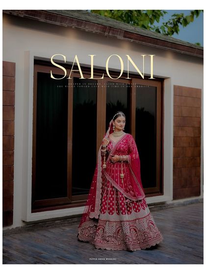 A regal, magazine-style portrait of the bride in her magnificent red lehenga, looking every bit the royal bride.