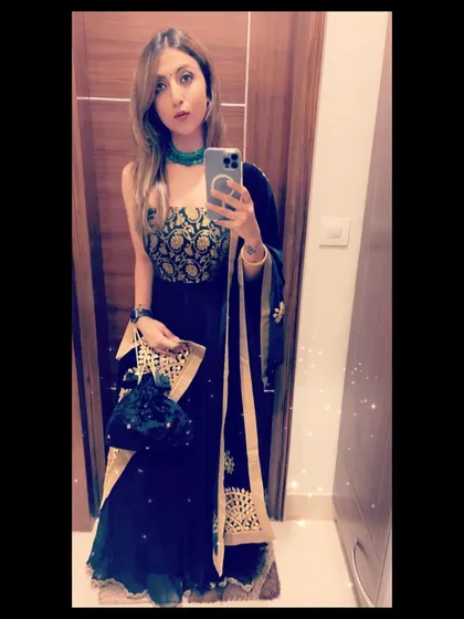A festive mirror selfie in a dark blue anarkali with a beautiful gold embroidered bodice.