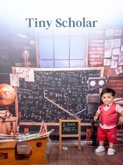 A tiny scholar ready for big things. This setup is perfect for celebrating a milestone like a first birthday while looking ahead to a bright future.