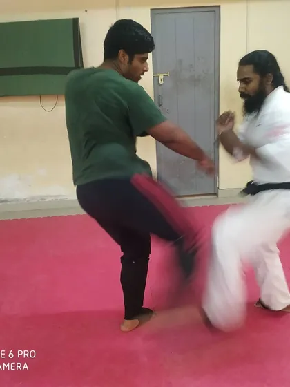 A dynamic exchange of kicks during a training session. Sparring builds timing and reflexes.