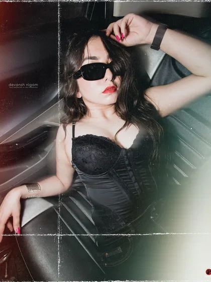 Another angle from the retro shoot, showing the full black corset and pants outfit.