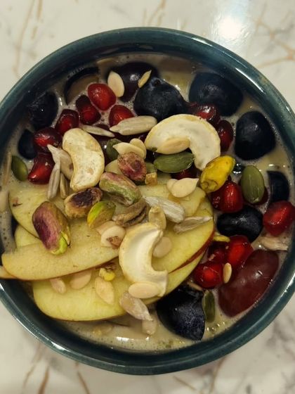 A beautiful and nutritious fruit and nut bowl. A great way to get a variety of vitamins, minerals, and healthy fats.
