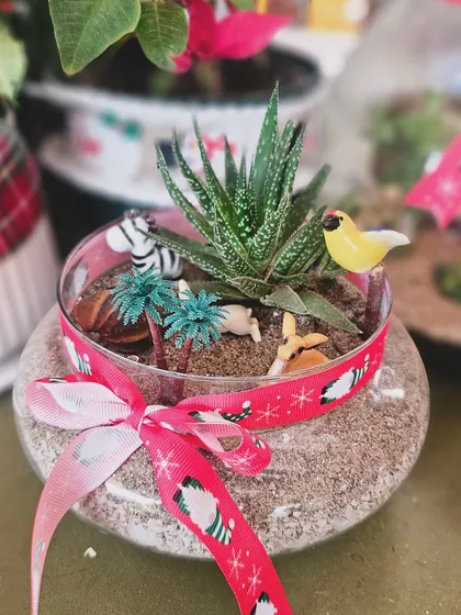 A close-up of one of our Christmas terrariums, complete with a tiny winter animal scene. It's a magical little world to gift to someone you love.