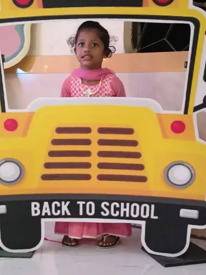 We also provide fun photo props like this 'Back to School' bus cutout, which was part of a larger Cocomelon theme. It's a great way for kids to take fun pictures.