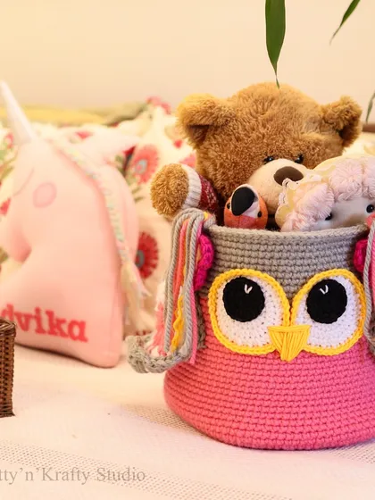 The Owlie Basket in a child's room, ready to be filled with treasures. The playful design makes tidying up a little more fun for everyone.