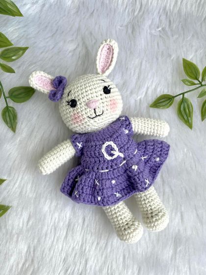 A lovely bunny in a purple dress with a custom initial "Q" on it. I made a similar one for my own daughter's birthday, and she absolutely adores it!