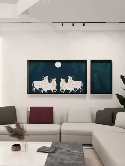 A family living area concept for the Gulecha Residence, featuring a large sectional sofa perfect for lounging. The artwork of Pichwai horses adds a traditional touch to the modern space, reflecting the client's personal taste.