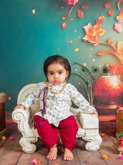 Looking poised and calm in our festive setup. We work to make babies comfortable so we can capture a range of expressions, from playful to serene.