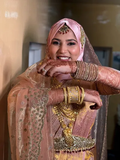 I love working with brides from all cultures. Here is a beautiful Nikkah look I created for my student. The makeup is soft and radiant, complementing her stunning pink and gold attire and elegant hijab draping.