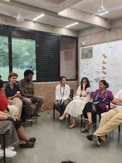 An informal discussion with students and faculty after the jury session. These conversations outside the formal review are often where the most meaningful exchanges happen.