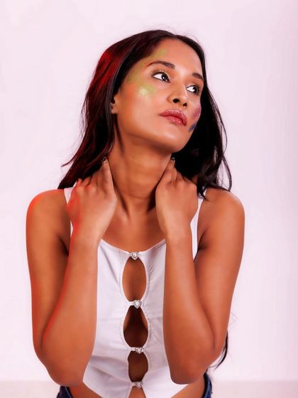 A thoughtful and elegant pose. The lighting is soft, and her expression is serene and beautiful.