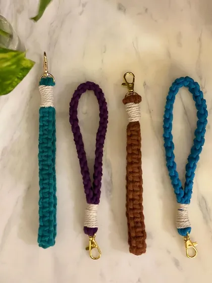 A collection of my macrame wristlets in four different colors and knotting styles. Each one is finished with a high-quality gold-tone lobster clasp.