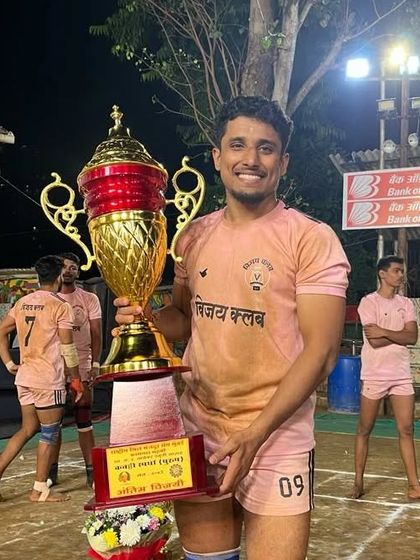 Another proud moment for Ajinkya, posing with the 'Best Raider' trophy.