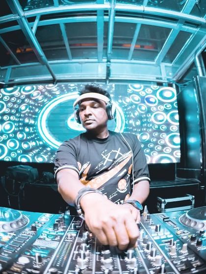 A fisheye view from the DJ booth, capturing the full console and the vibrant LED backdrop. This setup gives me all the tools I need to deliver a killer set.